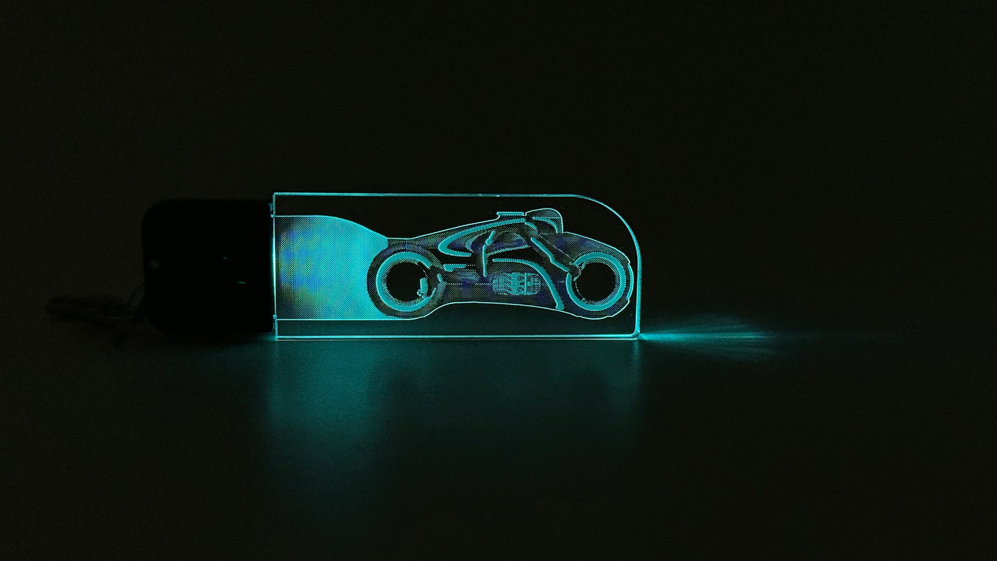 TRON Legacy - Encom-786 Light Cycle - LED Illuminated Keychain - Perfect as a gift for a fan.  - Made in the USA! - Led Zipper Pull